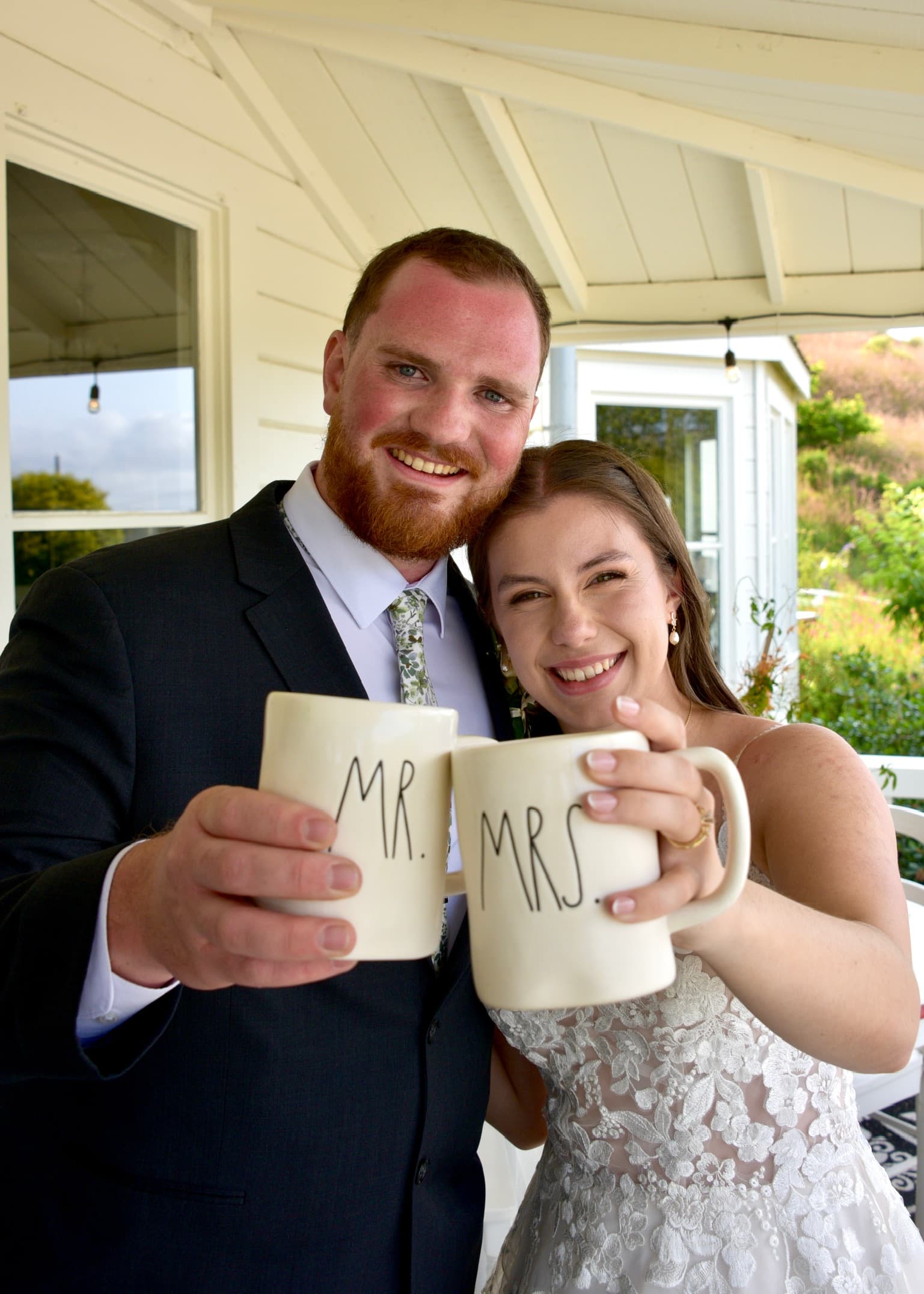 Redbeard and his wife on their wedding day, toasting with Mr. and Mrs. mugs