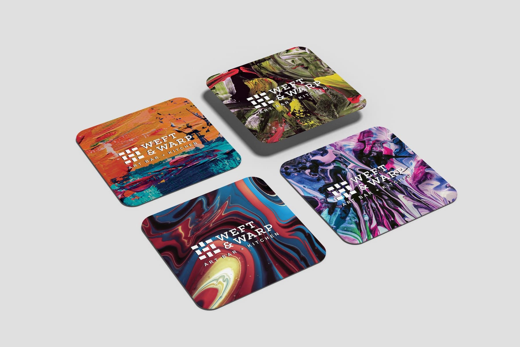 The four acrylic coasters, laid out